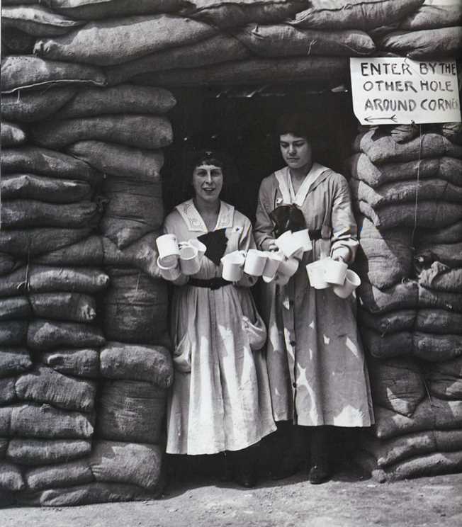 Lady volunteers clutch tea mugs in a London YMCA dugout, erected as an air raid shelter in WWI--Readers Digest UK